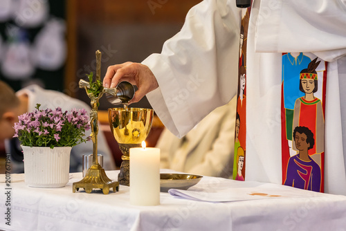 Photos offering of water and wine during a Eucharistic celebration
