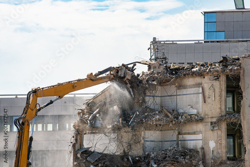 Fotografie Construction site, demolition of reinforced concrete structure, gutting and reno