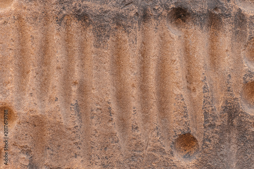 Carved sandstone texture background with abstract erosion pattern and copy space