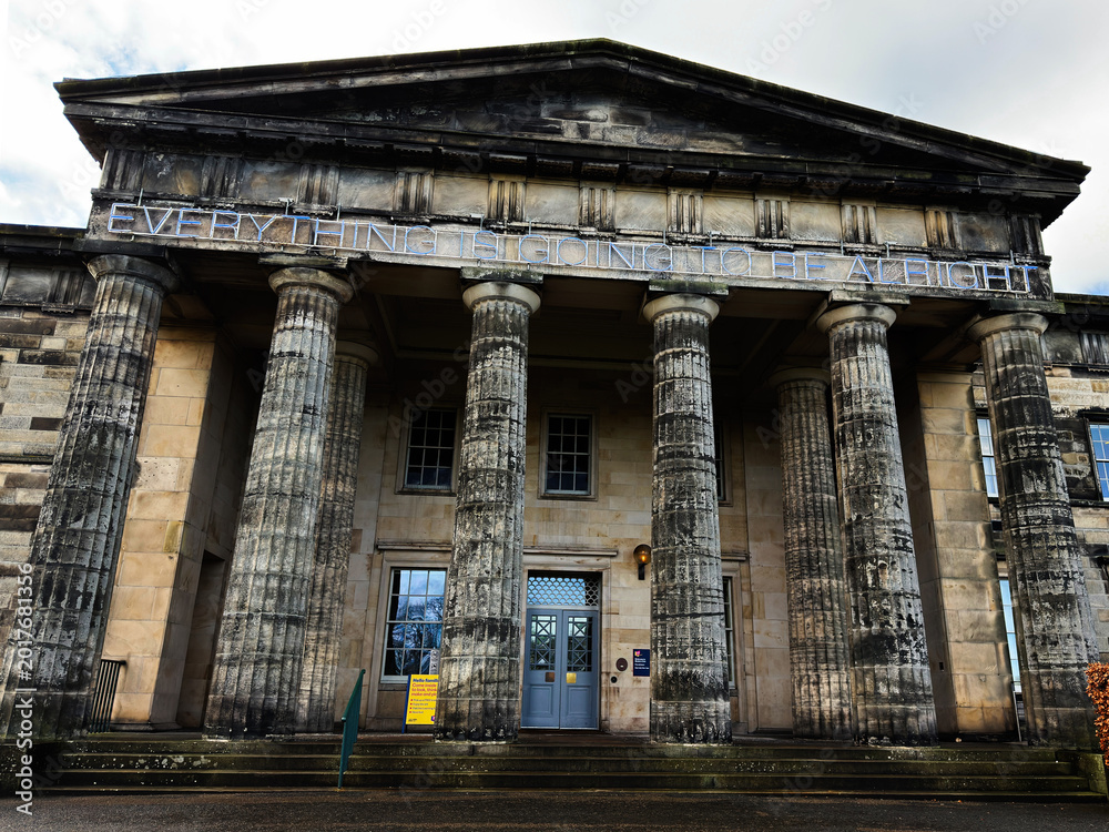 Naklejka premium Neoclassical National Galleries Scotland, Modern One stone building with tall fluted columns and neon sign reading Everything Is Going To Be Alright at the entrance in Edinburgh, Scotland, UK