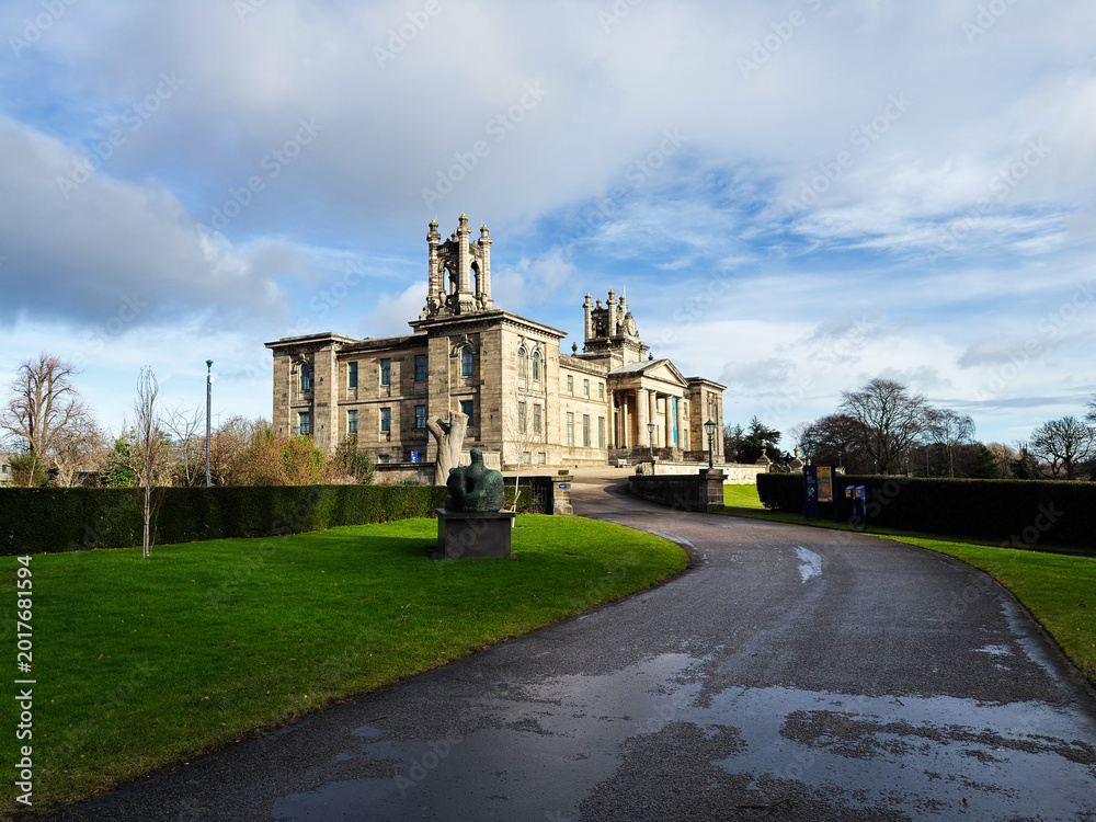 Fototapeta premium Historic neoclassical Modern Two museum building with sculpture and grounds in Edinburgh, Scotland, UK set against a dramatic cloudy sky