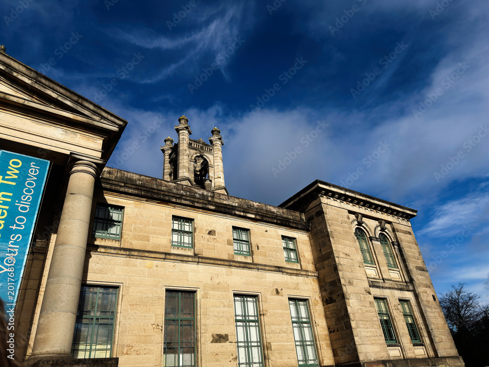 Fototapeta premium Historic neoclassical Modern Two Dean Gallery building with bell tower in Edinburgh Scotland UK under dramatic blue sky