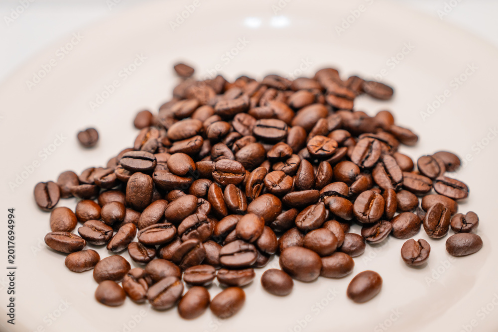Fototapeta premium coffee beans in a cup