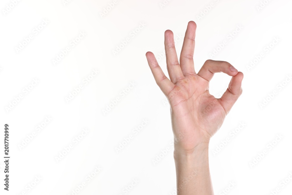 Naklejka premium Man showing ok gesture on white background, closeup. Space for text