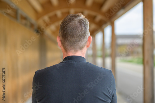 Anonymous mature man rear portrait
