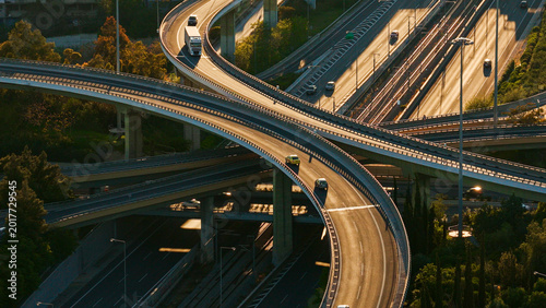 Obraz na płótnie Complex road infrastructure featuring a multi-level highway interchange with man