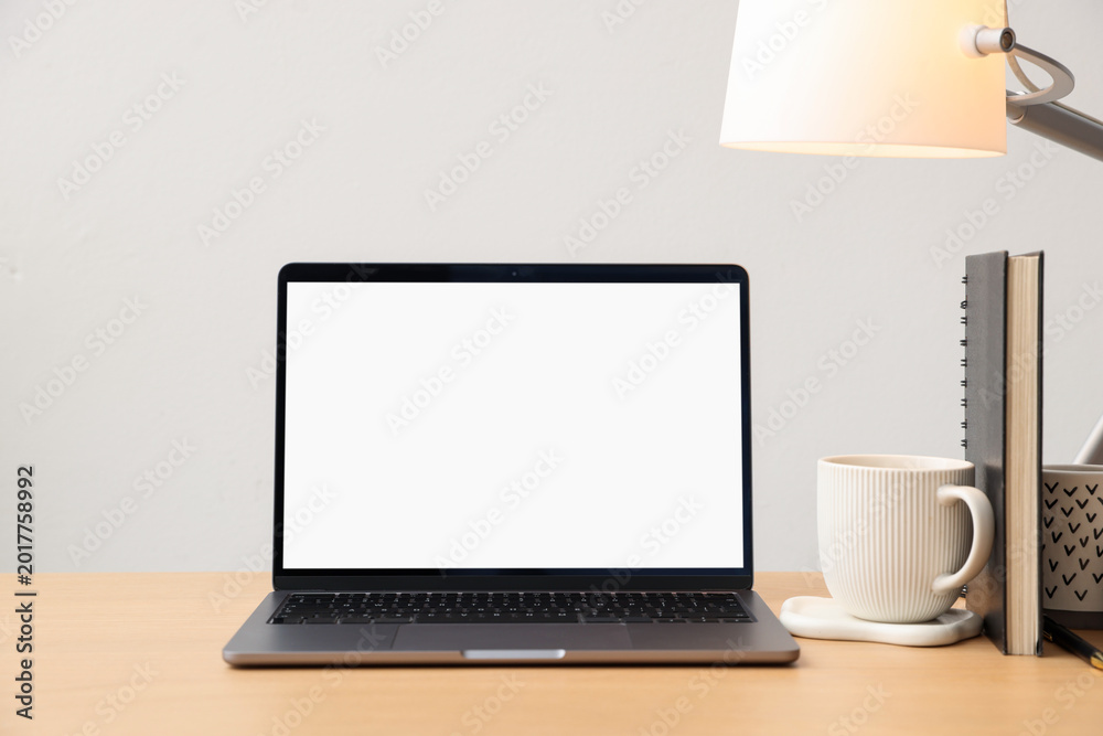 Fototapeta premium Stylish workplace with laptop, stationery, cup and decor indoors