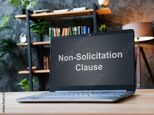 Non solicitation clause on laptop screen. Business legal agreement concept.
