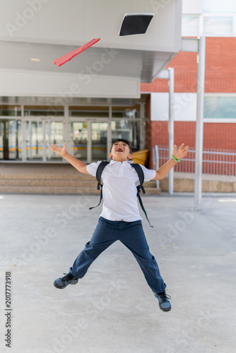 Joyful schoolboy celebrates last day with enthusiasm