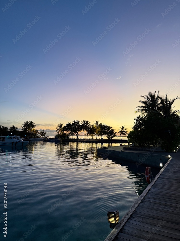 Fototapeta premium Exotic island sunset with dramatic sky in the Maldives