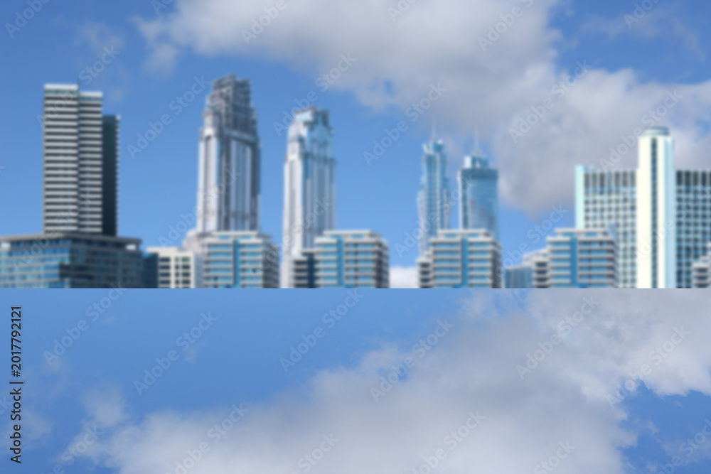 Fototapeta premium Modern buildings and mirror surface reflecting sky, selective focus