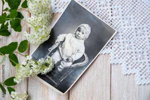 Bilde på lerret antique baby portrait photograph, vintage album, aged paper texture, flowers, wo