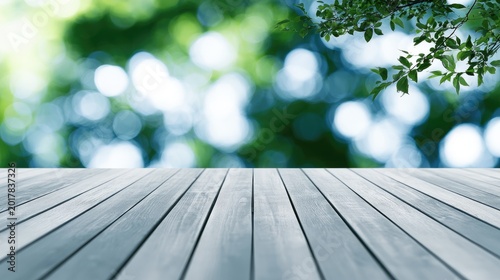 Wooden planks foreground with soft green and blue bokeh background