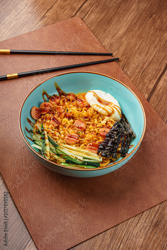 Spicy noodle bowl with chicken and egg
