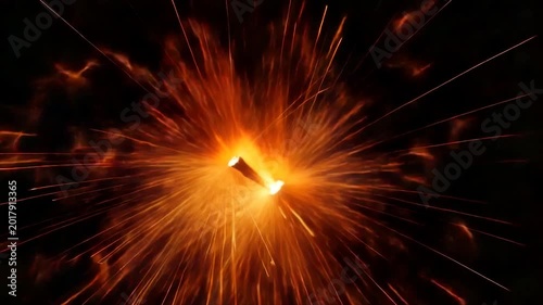 Glowing core explodes outwards, radiating fiery streaks against a dark backdrop