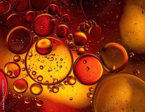 Abstract oil bubbles in red and orange liquid, macro texture, warm glow, liquid , creative design