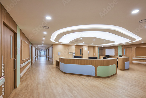 Clean Hospital Front Desk Interior With Spacious Corridor