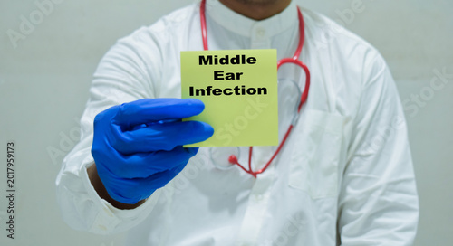 Konstfotografi Doctor holds in hands a card with the name of the middle ear infection