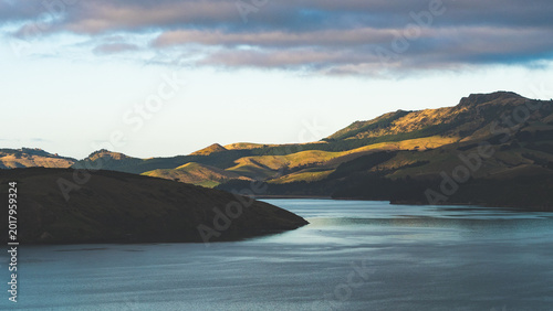 lake sea ocean and mountains in background hills canterbury christchurch new zealand