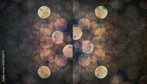Symmetrical arrangement of large warm circular bokeh lights over a dark background, evoking a sense of nostalgic wonder, abstract artistic design, and dreamy vintage-style evening atmospheres.