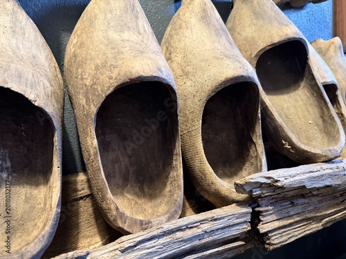 Wooden clogs displayed on a shelf - Sabots de bois exposés sur une étagère