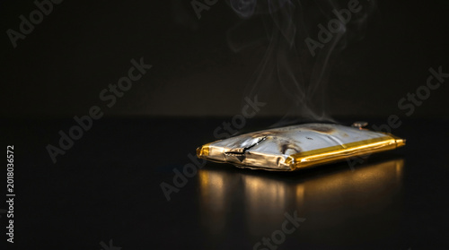 High End Technology Failure Concept Featuring Damaged Phone Battery