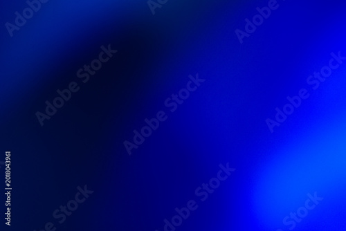 Abstract deep blue gradient background with soft light leaks. Smooth blurry texture, ideal for elegant backdrops, modern technology themes, or creative digital art overlays.