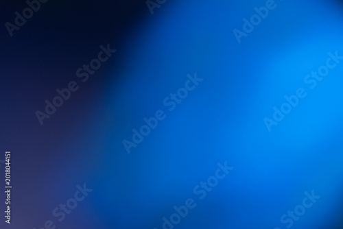 Abstract dark blue gradient background with smooth light leaks. Elegant soft bokeh texture for professional graphic design, corporate presentations, and modern digital art backdrops.