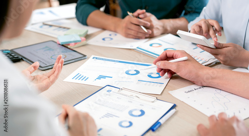 Collaborative Business Team Analyzing Financial Growth and Sales Reports