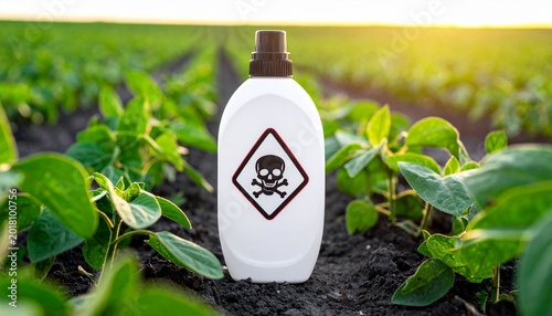 Toxic pesticide bottle in field