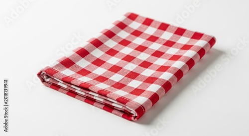 Red and white checkered napkin, folded cloth on a white background.