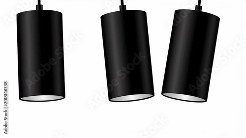 Three black cylindrical pendant lights hang against a white background