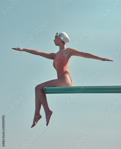 Принти на полотні Woman, athlete or swimmer on diving board outdoor with stretching, practice or training for competition