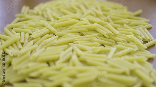Uncooked Penne Pasta On Wooden Table Dry 03