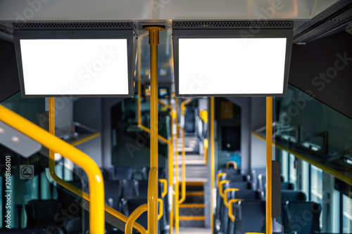 Mockup design for empty bus interior with blank panels for display or advertising