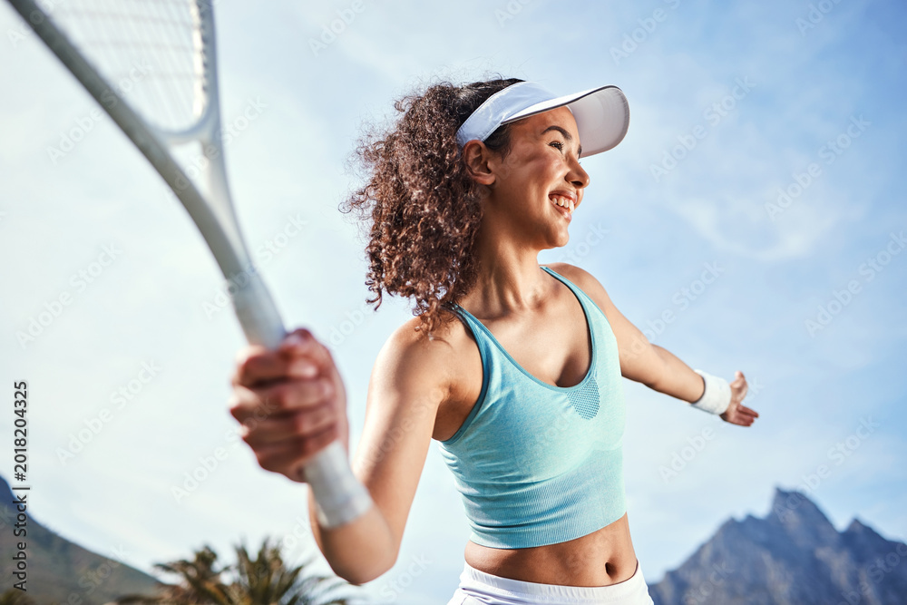 Fototapeta premium Tennis court, athlete and happy woman with racket for workout, training and prepare for competition. Outdoor, fitness and person with equipment for game, low angle and getting ready for tournament