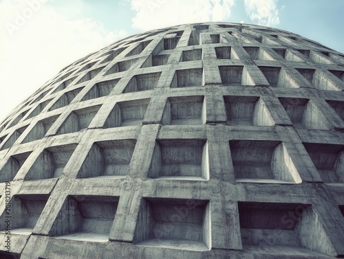 Concrete dome structure with layered design showcasing unique architectural features against a clear sky