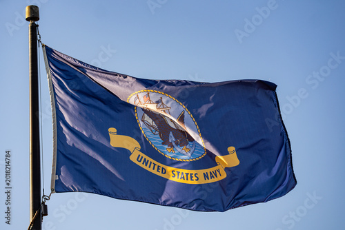 Konstfotografi Navy flag waves beside blue sky