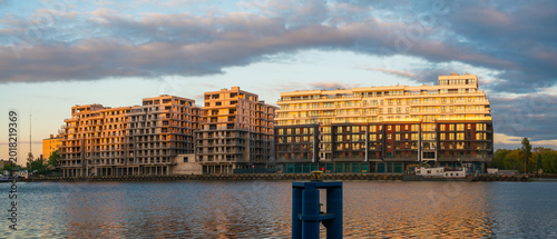 A modern housing estate of multi-story residential buildings by the river