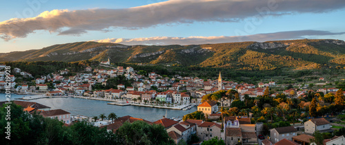 Vászonkép Jelsa—a fishing village on the island of Hvar, bathed in the rays of the rising