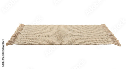 Beige woven rug with fringes isolated on black background
