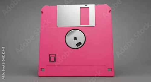 Bright pink magnetic storage medium sits centered against a neutral gray backdrop