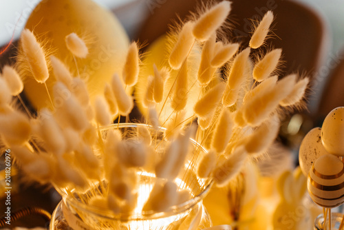 A warm-toned decorative arrangement of dried bunny tail grass used for creating stylish bouquets and floral designs.