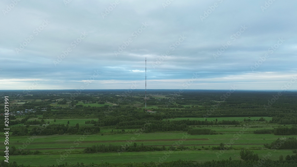 Fototapeta premium Global connection technology tower in wide landscape