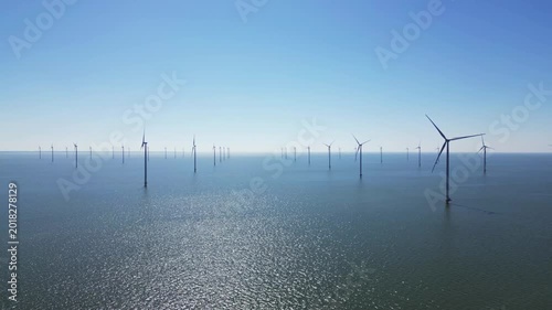 Water texture, wind turbines produce energy in the north sea, wind farm power plant view from height, green energy and alternative energy sources, windmill.
