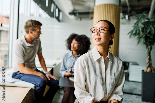 Group of young business people having a meeting or presentation and seminar in the office. Portrait of a young businesswoman