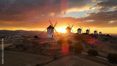 Scenic aerial view of Don Quixote's windmills at sunset in the La Mancha region, Spain