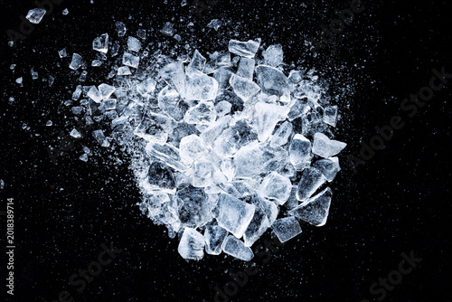 A scattering of ice cubes on a black background.