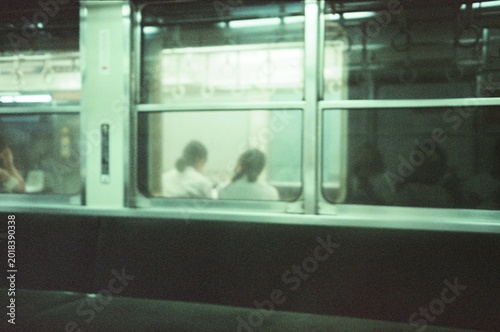 Young woman looking through the window