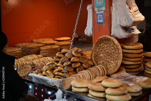 treet Scene in Urumqi Xinjiang with People’s Cinema and Traditional Nang Bakery, Uyghur Cultural Life